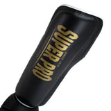 Super Pro Combat Gear Scheenbeschermer Protector SE Zwart/Goud/Wit